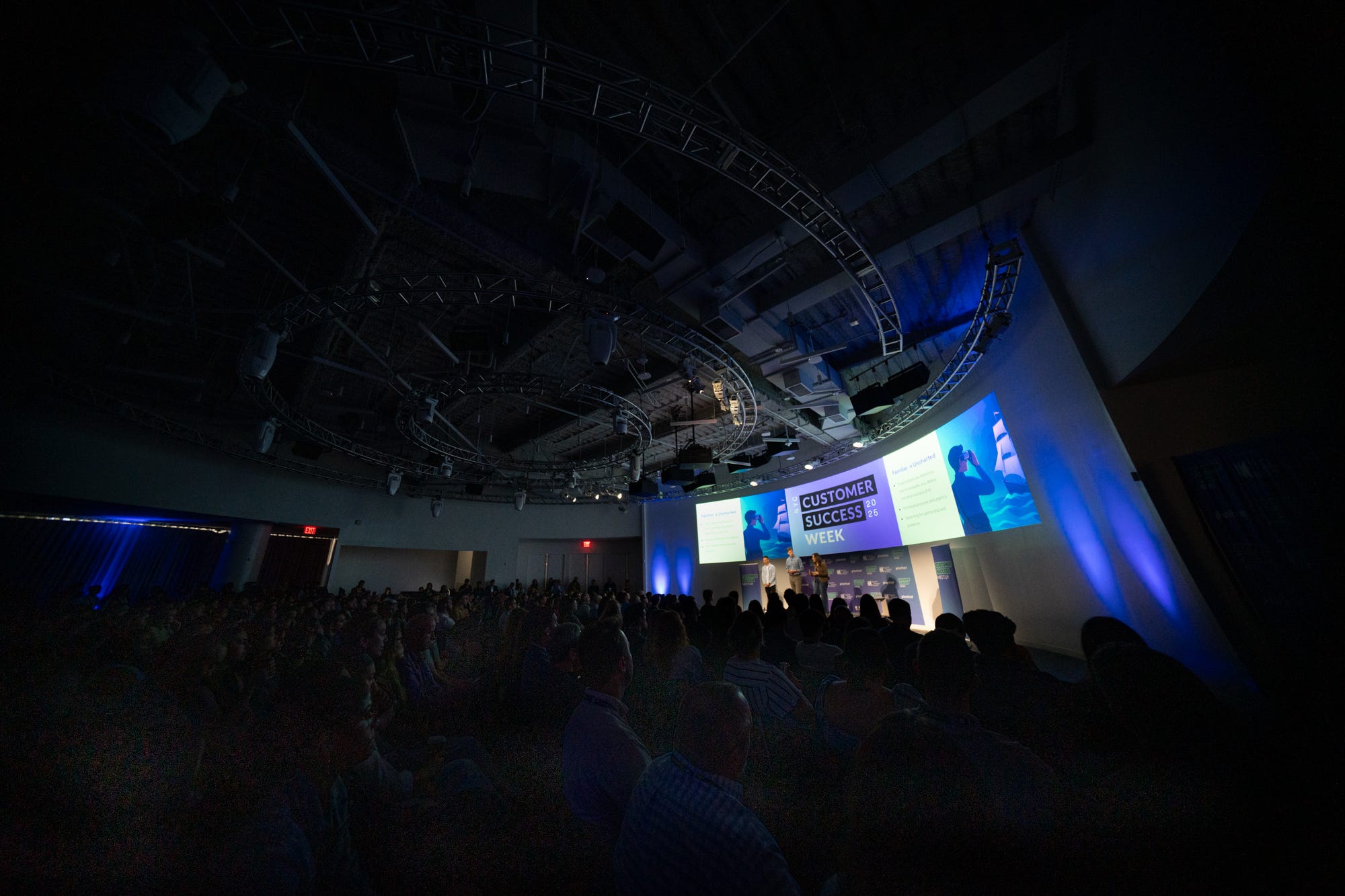 Customer Success Week keynote stage with a packed audience